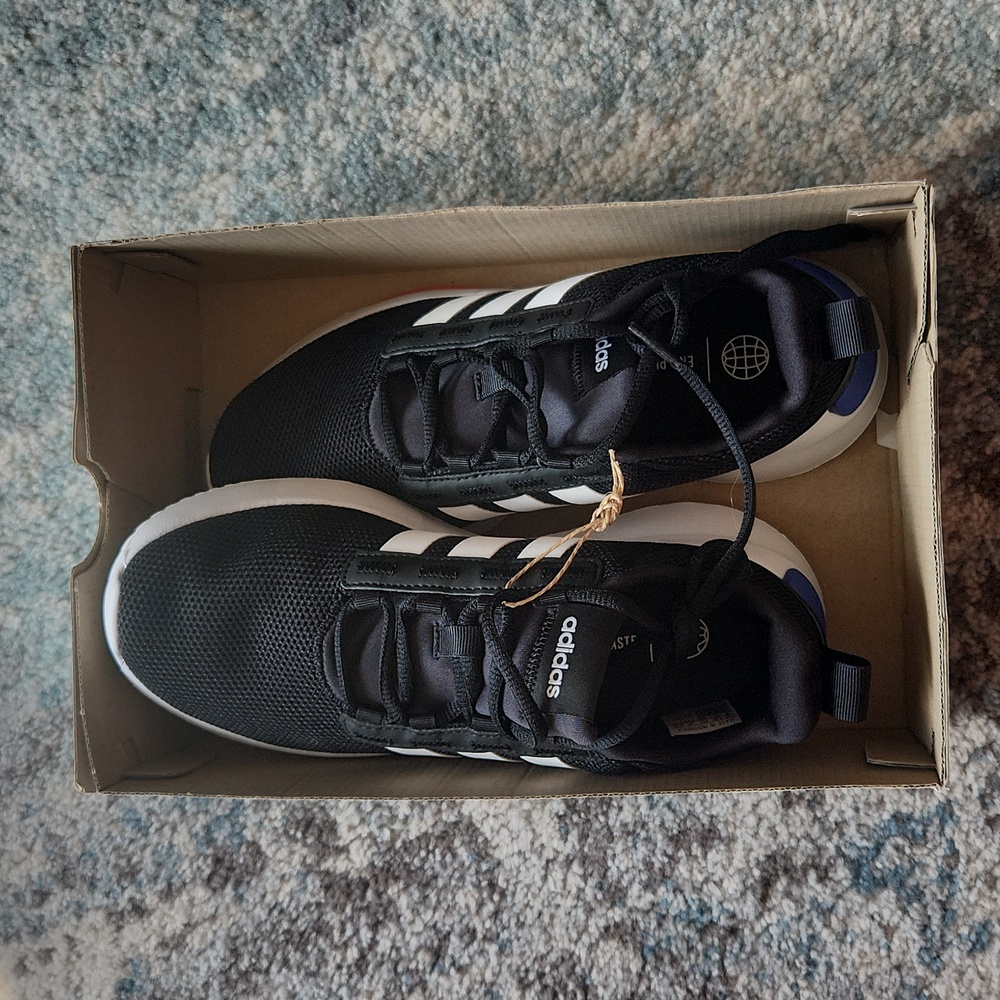 Boys size 4 adidas shoes, brand new in box. Black and white